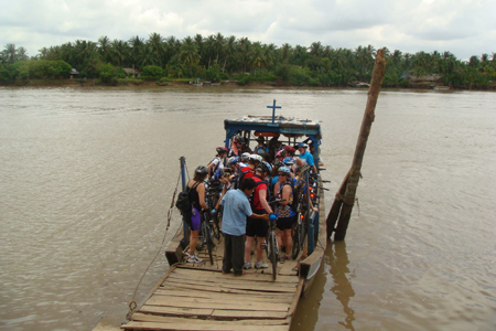 On the ferry to Can Tho - Vietnam school tour package