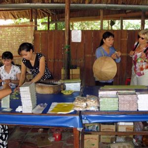 Travelers visiting coconut candy workshop in Ben Tre