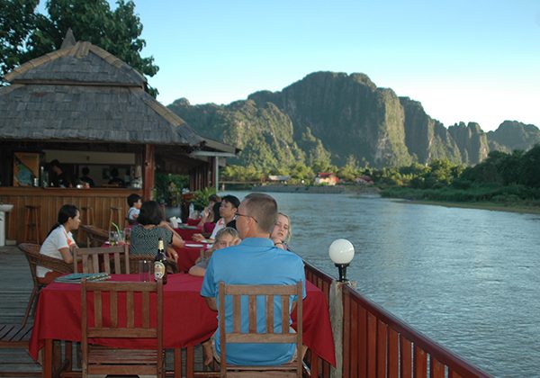 meal beside the river - Laos tours