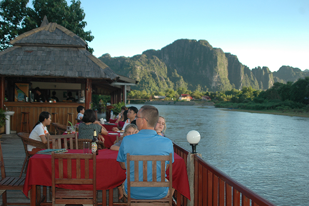 meal beside the river - Laos tours