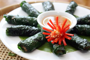 Grilled Beef Wrapped in Betel Leaves with beautiful decoration and tasty sauce