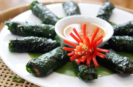 Grilled Beef Wrapped in Betel Leaves with beautiful decoration and tasty sauce