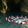 Swimming in the crystal clear water of E cave (Trung Tre cave)