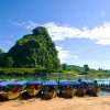 Walk to boat whraf and take a pleasant boat trip to Phong Nha Cave