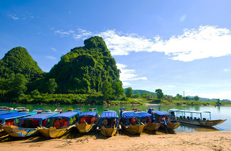 Walk to boat whraf and take a pleasant boat trip to Phong Nha Cave