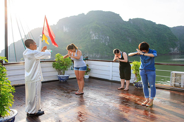 halong bay tai chi lession in the morning