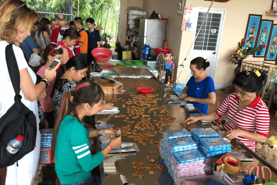 Making coconut candy in Ben Tre Vietnam tour package