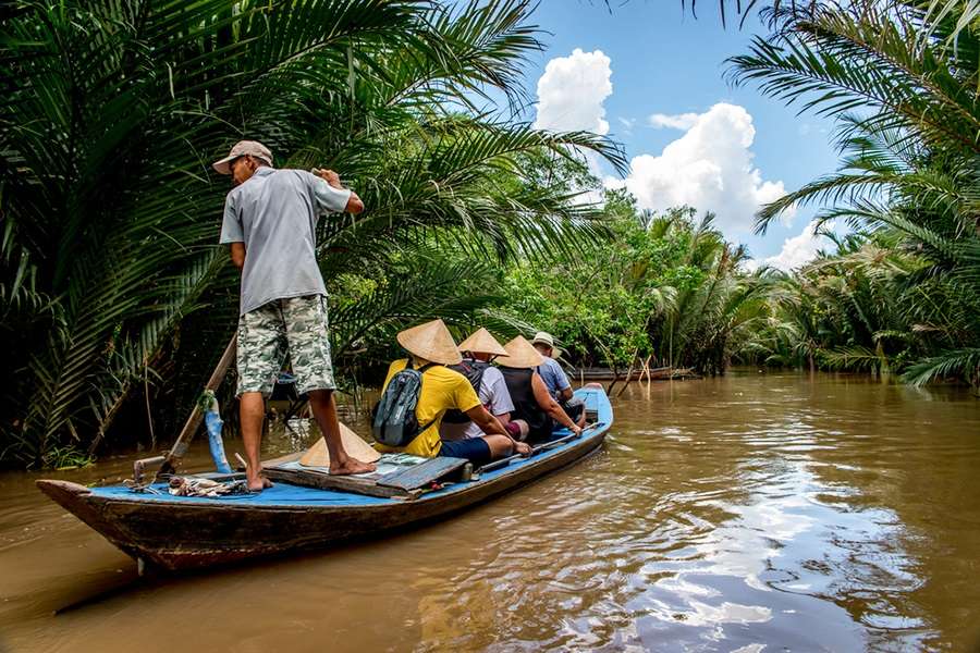 Rowing through Mekong Delta - Vietnam tour package