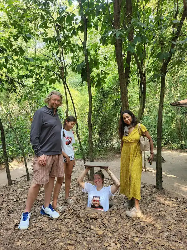 cu chi tunnels - happy guests travelling with vietnam local tour operators