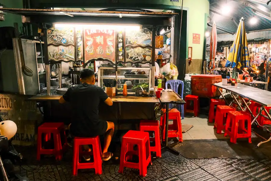vietnam rainy season - eating street food