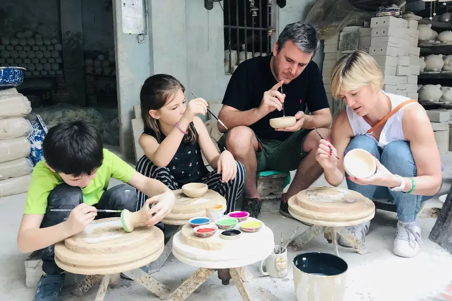 customers trying to become a pottery master in vietnam